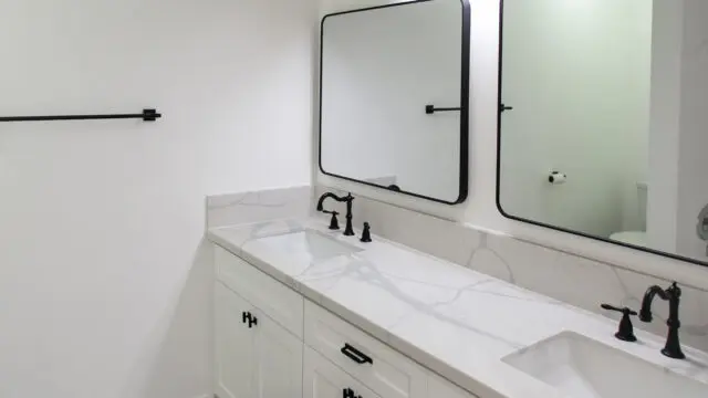 Modern bathroom with double vanity sinks.