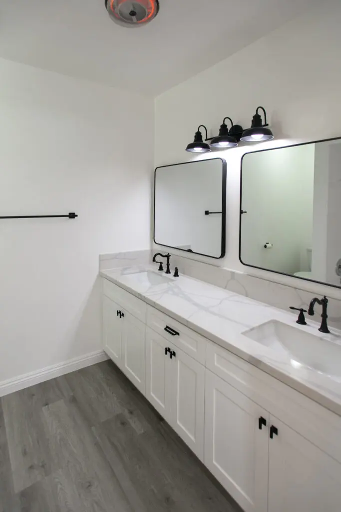 Modern bathroom with double vanity sinks.
