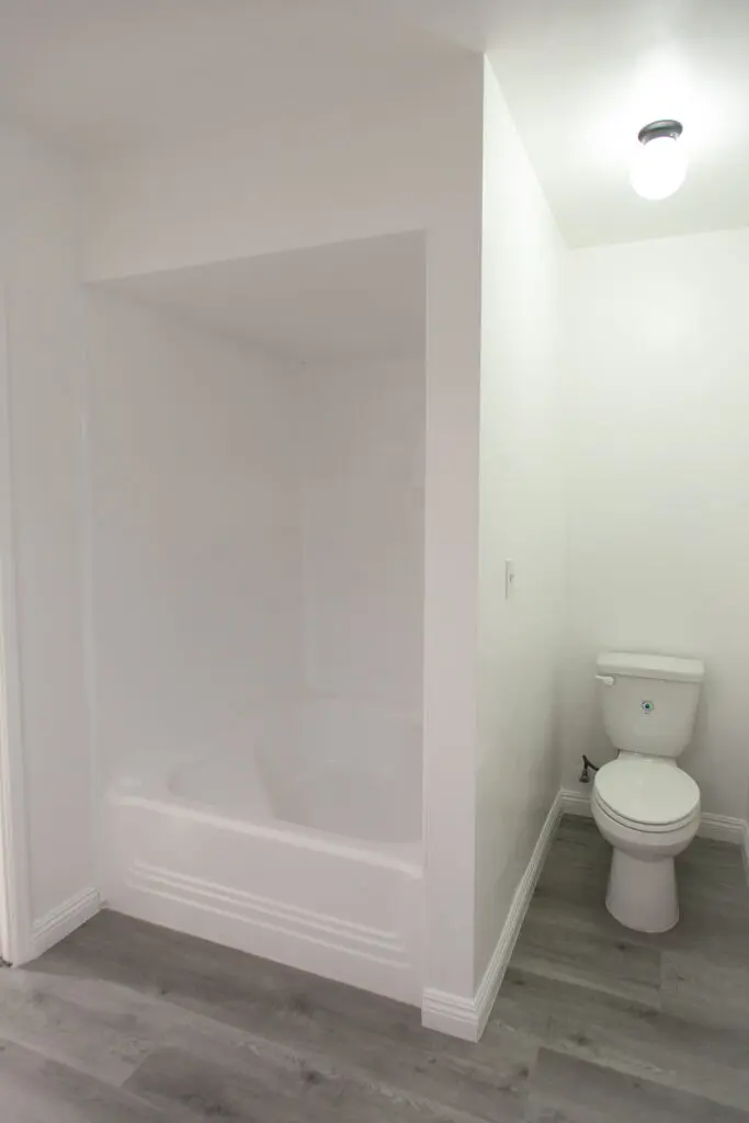 Bathroom with bathtub and toilet.