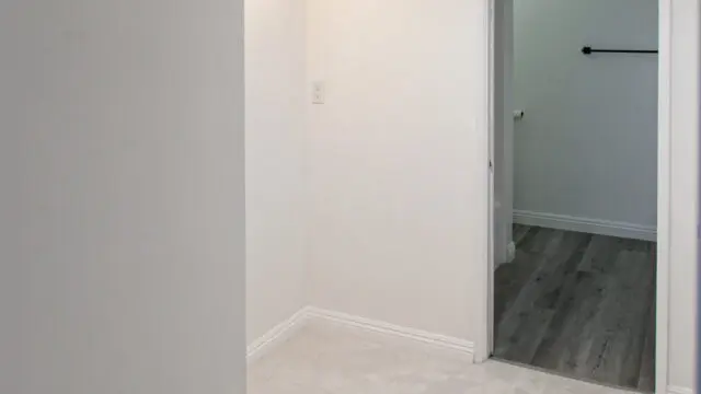 Small, empty room with open doorway.
